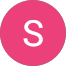 A pink circle with a white, uppercase letter S centered inside; the background is light gray.